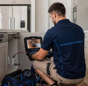 Clearing a blocked sink at a Waverley property
